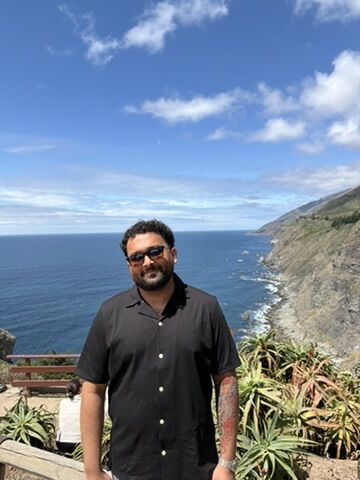 Tanmay at an overlook on the Big Sur coast