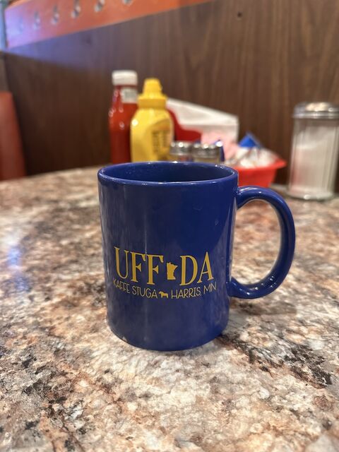 An Uff Da mug on a diner counter